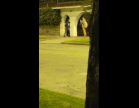 Girl dances on sidewalk