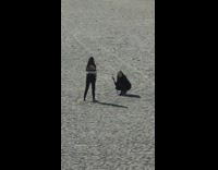 Girl poses for photo at beach