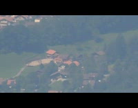 Super zoom view of Swiss houses from mountains 