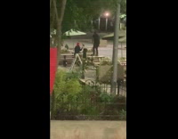 Man Stands and Dances on Table Bench for Video