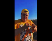 Guy does tricks with trompo toy 