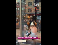 Woman wears halter top in 53 degree weather