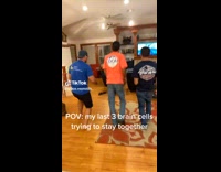 Three guys dancing together living room 