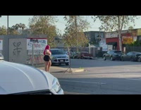Chubby woman pink hair street ring light