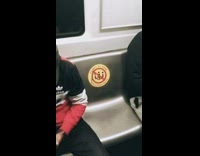 Guy sits by do not sit sticker 