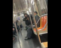 Shirtless guy black jacket tries to strangle himself on subway train