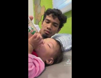 Dad pranks toddler with baby bottle 