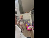 Woman entertains her hungry toddler to stop the screams