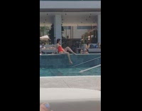 Collab IITW - Woman red bikini poses at the poolside