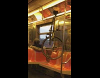 Bicycle hangs on metal bar train 