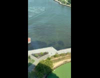 Man shows dark shades underneath river water