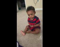 Little kid is scared of rainbow horse toy