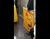 Guy riding subway holds anti vax poster