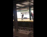 man plays electric guitar station