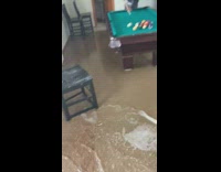 High tide ocean water floods house billiards 