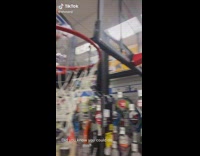 Collab BitchIG2 - Guy removes plastic covering on basketball hoop