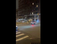 Filmer react to two christmas cars on street