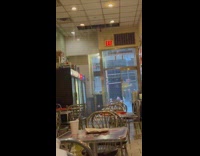 Rain Pours Inside Convenience Store as Couple Eats