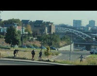 Man jumping jacks on overlooking with cameraman