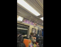 Train passenger waits in blue outfit