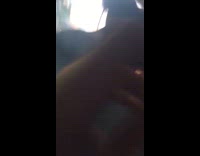 group of kids watch fireworks they go off under car