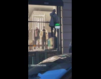 Guy dancing on top of the subway stair exit