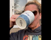 Pet Owner Sips Coffee While Cat Wants to Join