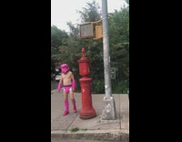 Pink storm trooper mask guy sidewalk car