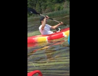 Guy black white dog red yellow kayak 