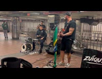 Cop joins band perform on subway station