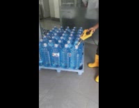 Water bottles pallet yellow boots brown pants