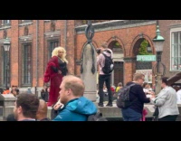 Collab IITW - Woman black red dress poses at park