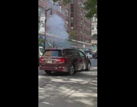 Bicycle on fire along the street at day