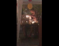 Woman checkered shirt phone lights food baloon