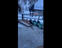 Woman breaks table trying to catch candy with mouth at ski resort