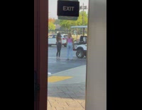 Two women tiktok dance near the golf cart