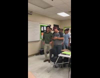 Group of boys in class dancing quinceanera
