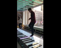 Couple plays giant piano with feet 