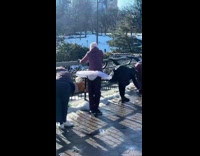 Lady wears white tutu skirt while stretching