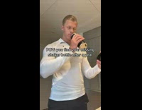 Collab BitchIG2 - Guy white shirt opens black bottle and smells it