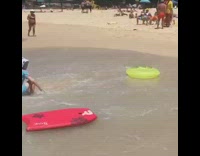 White Bucket Hat Girl Tossed Around Yellow Floatie at Beach