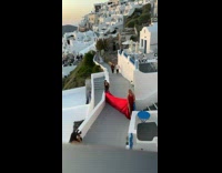 Woman long red dress Santorini Greece pictorial