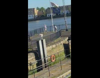 Girl white sweater dance video port flag