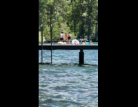 Woman in bikini dances for dock video