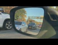 2 chucky dolls show head from car 