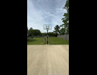 Lady Throws Ball Behind and Shoots to Ring