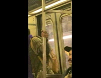 Guy sings on subway with mic and speakers