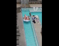 Three guys lay on floatie long pool