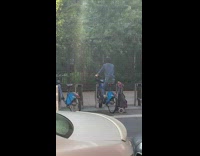Woman bikes backwards on still citibike 