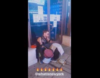Guy plays drums upside down buckets sidewalk 